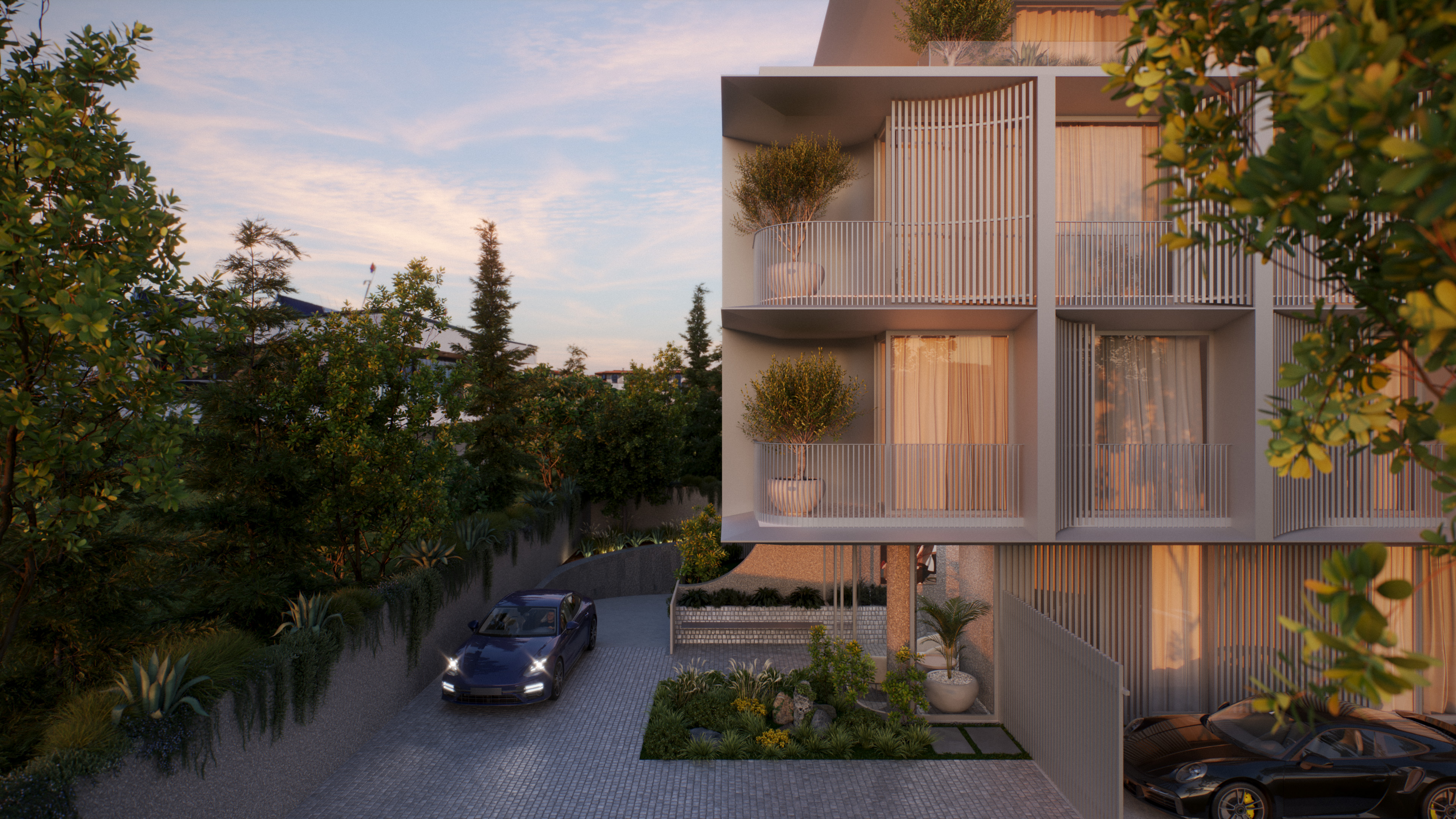 The sied face of the facade in the Komo building. A porshe is coming from underground garage. Beautiful green landscapes and the lobby are presenting a serene atmosphere.
